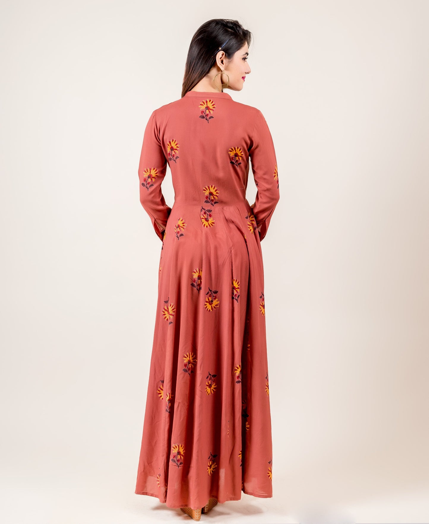 Anarkali Style Gown With Fancy Buttons In Rust Hue