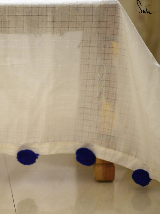 White cotton and silk threads with blue tassels