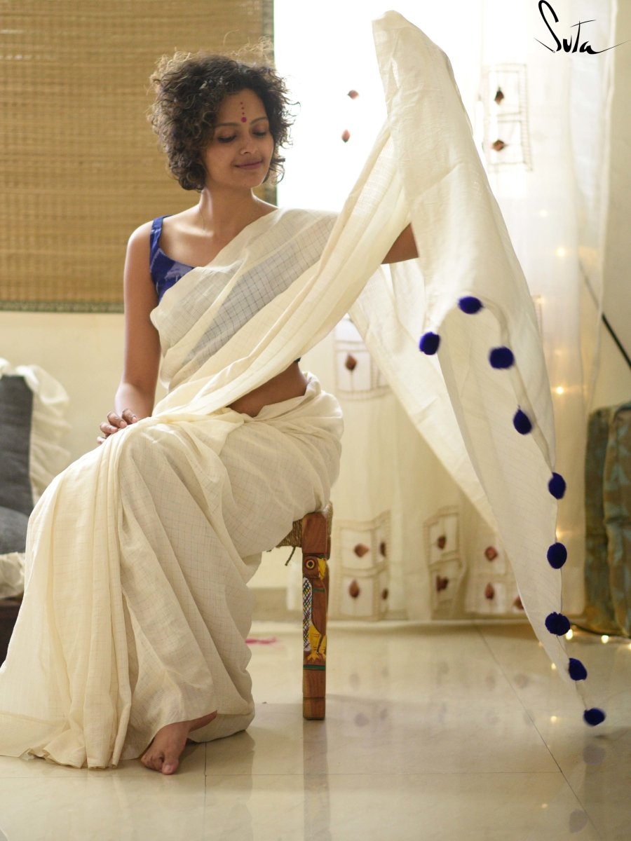 White cotton and silk threads with blue tassels
