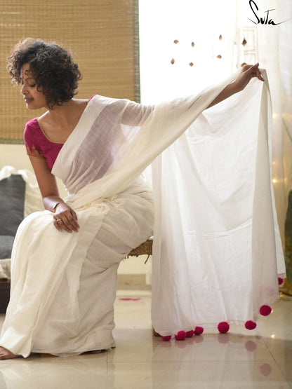 White cotton and silk threads with pink tassels