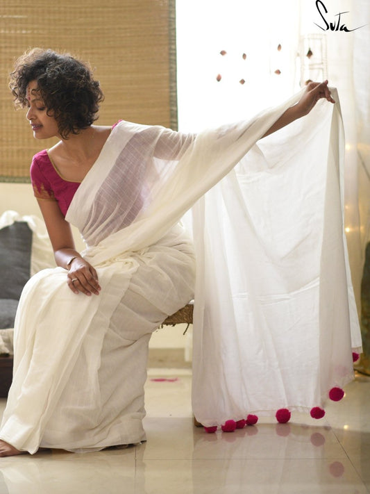White cotton and silk threads with pink tassels